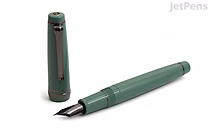 A green Sailor Pro Gear fountain pen with a 21k extra fine nib, shown uncapped with the cap placed beside it. This is the limited edition "Area 51" model.