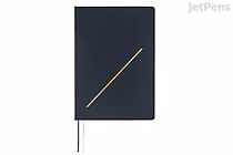 Navy Hobonichi Techo A5 English planner (2026 Jan start), textured cover with diagonal gold slash detail and two thin ribbon bookmarks (navy and gold).