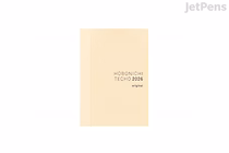 Cream Hobonichi Techo 2026 A6 planner (book-only), minimal cover with centered title, Monday-start weekly layout, January 2026 start.
