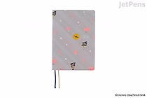 Hobonichi Techo HON A6 planner, ONE PIECE Hiriluk's Cherry Blossoms cover — light gray with scattered pink petals and small character icons; two ribbon bookmarks (blue, yellow).