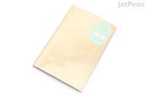 B6-sized Midori "Yuru Log" notebook with natural cream cover, MD Thick paper; free monthly diary layout, minimalist softbound design.