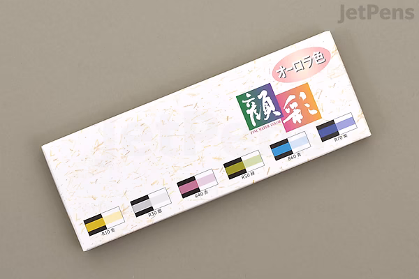 Top-down photo of a rectangular white box for Boku-Undo Gansai Watercolor Palette "Aurora" 6-color set, showing brand label and six small color swatches along the bottom edge.