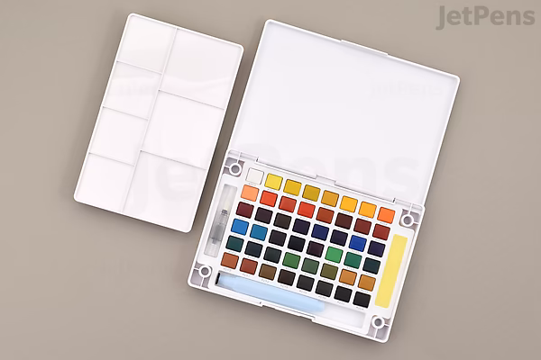Open Sakura Koi watercolor field sketch box with 48 half-pan color palette, removable white mixing tray/lid and included water brush.