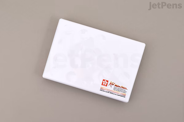 White rectangular Sakura Koi Watercolor Field Sketch box set tin, closed, with small logo at lower right, on a light gray background.