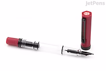 TWSBI ECO Plum with Onyx cap fountain pen, clear demonstrator barrel, visible piston filler, extra-fine nib, cap removed and placed upright beside pen.