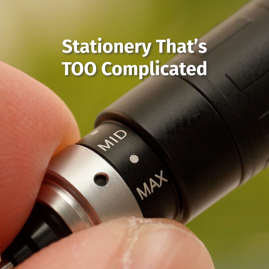 Close-up of fingers turning a black pen or precision tool with a rotating dial marked "MID" and "MAX" against a soft green background.