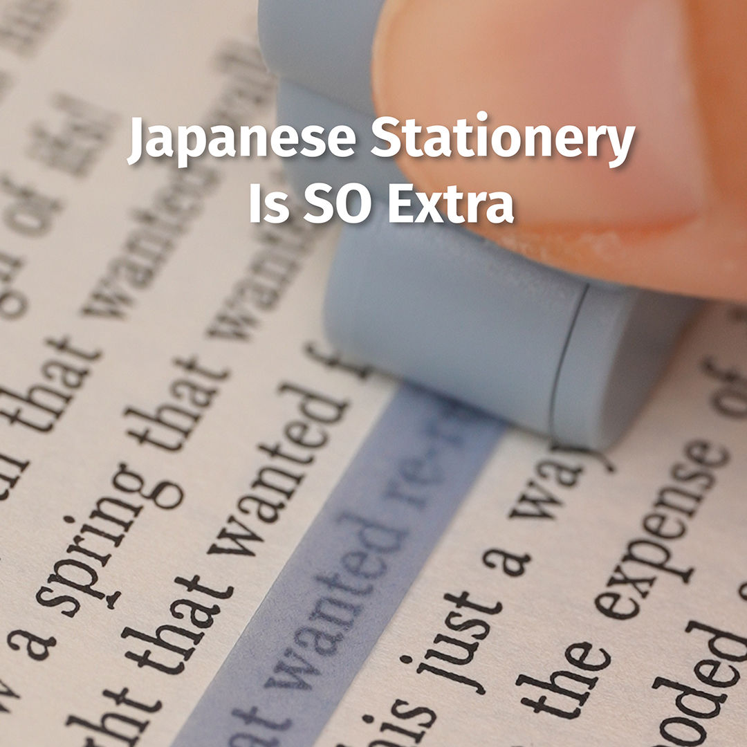 Close-up of a finger holding a small gray eraser removing a blue highlighter mark from printed book text.